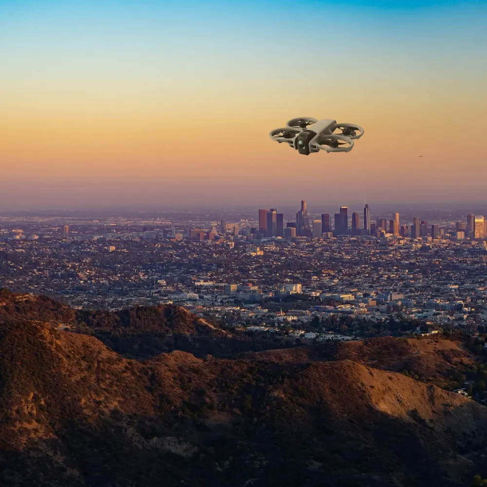 DJI Avata 360 against hills and open sky (composite image)