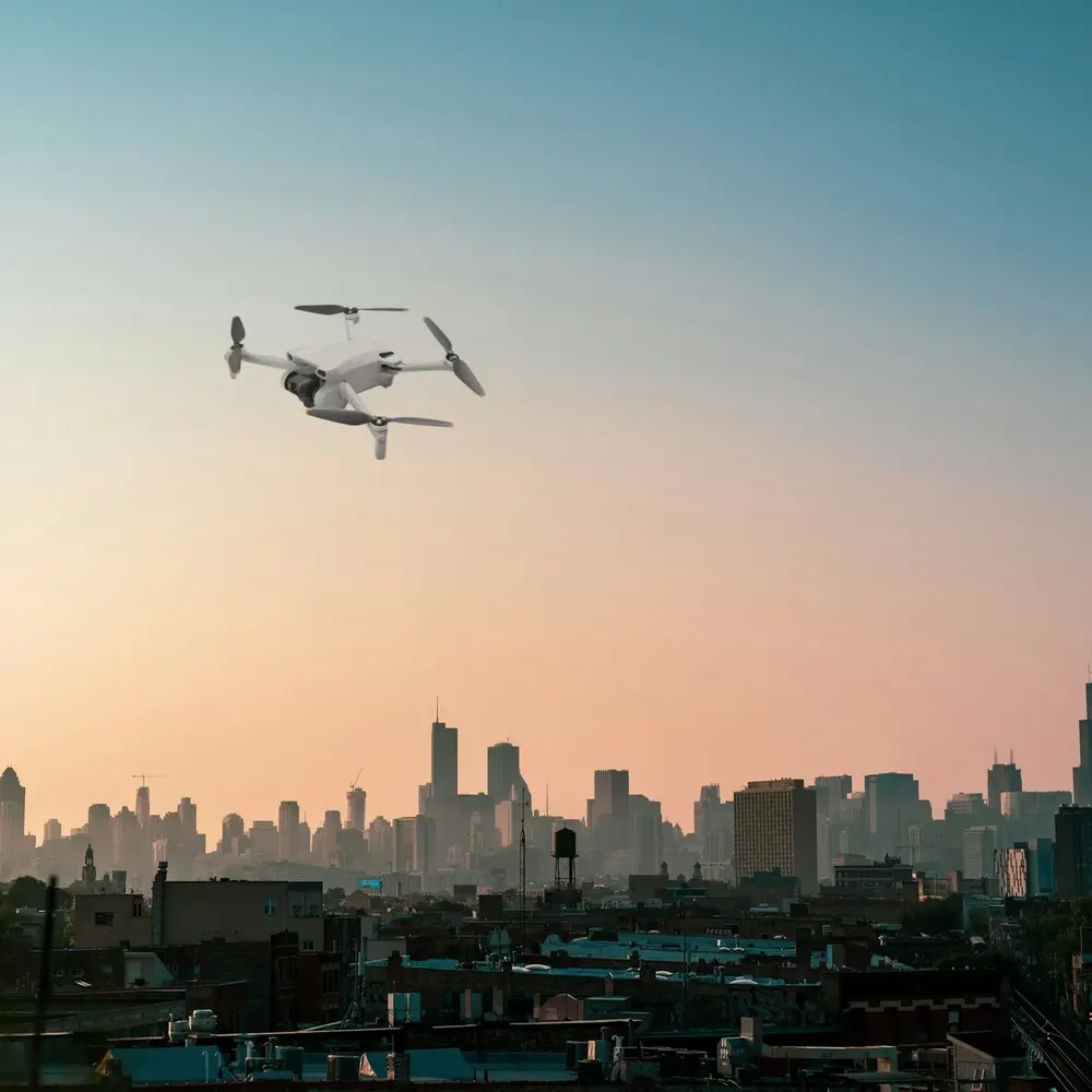 DJI Mini 3 against a city skyline (composite image)