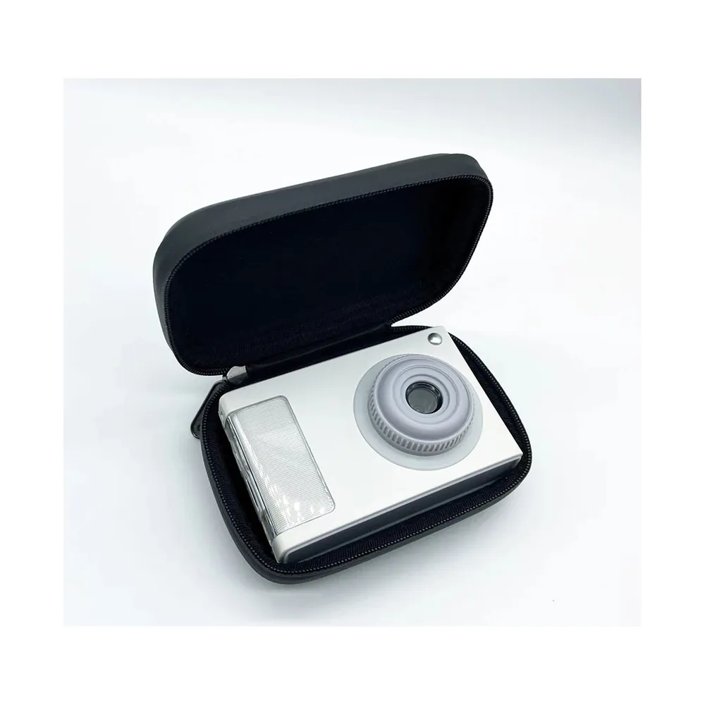 Hard EVA case open with a compact camera inside