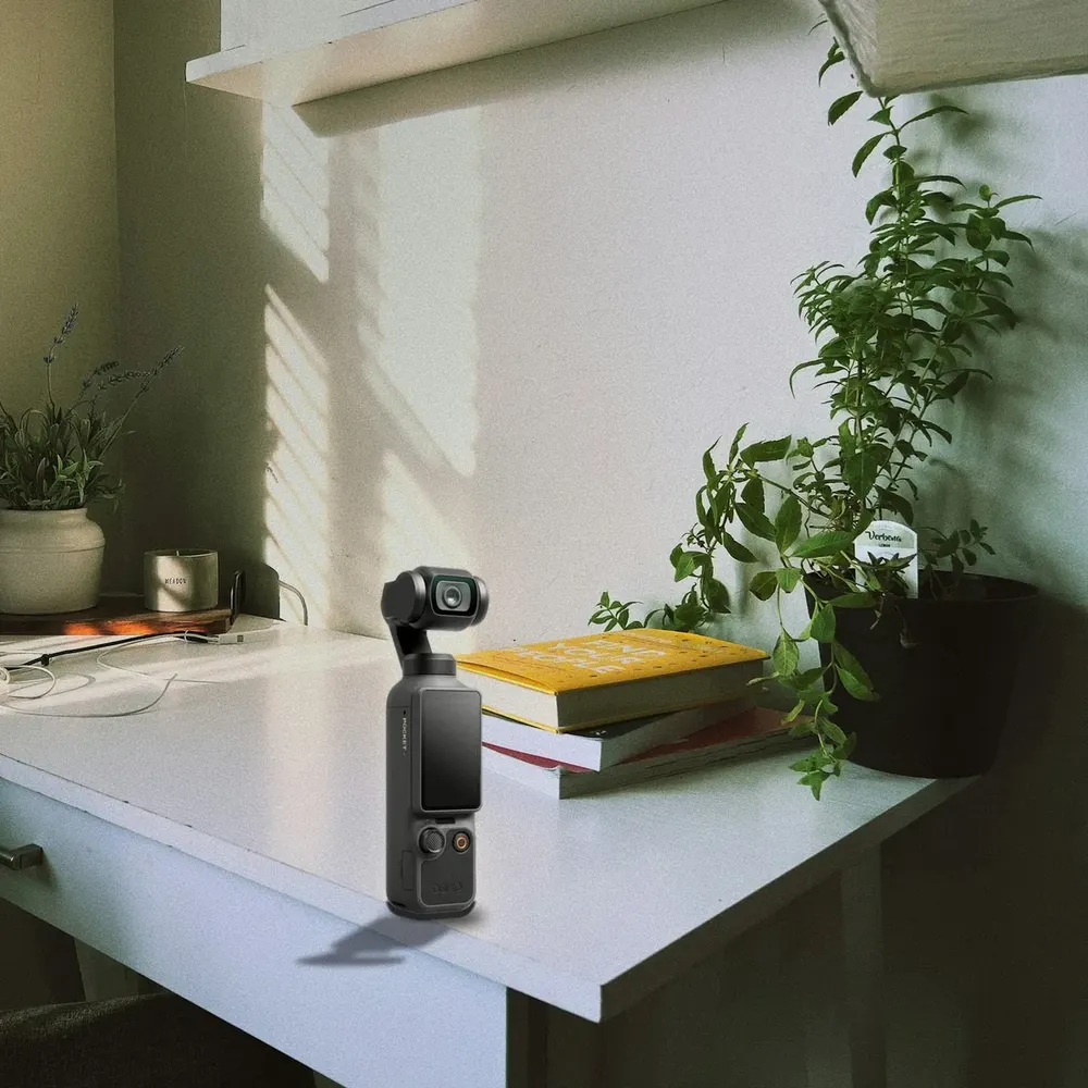 DJI Osmo Pocket 4 on a white desk