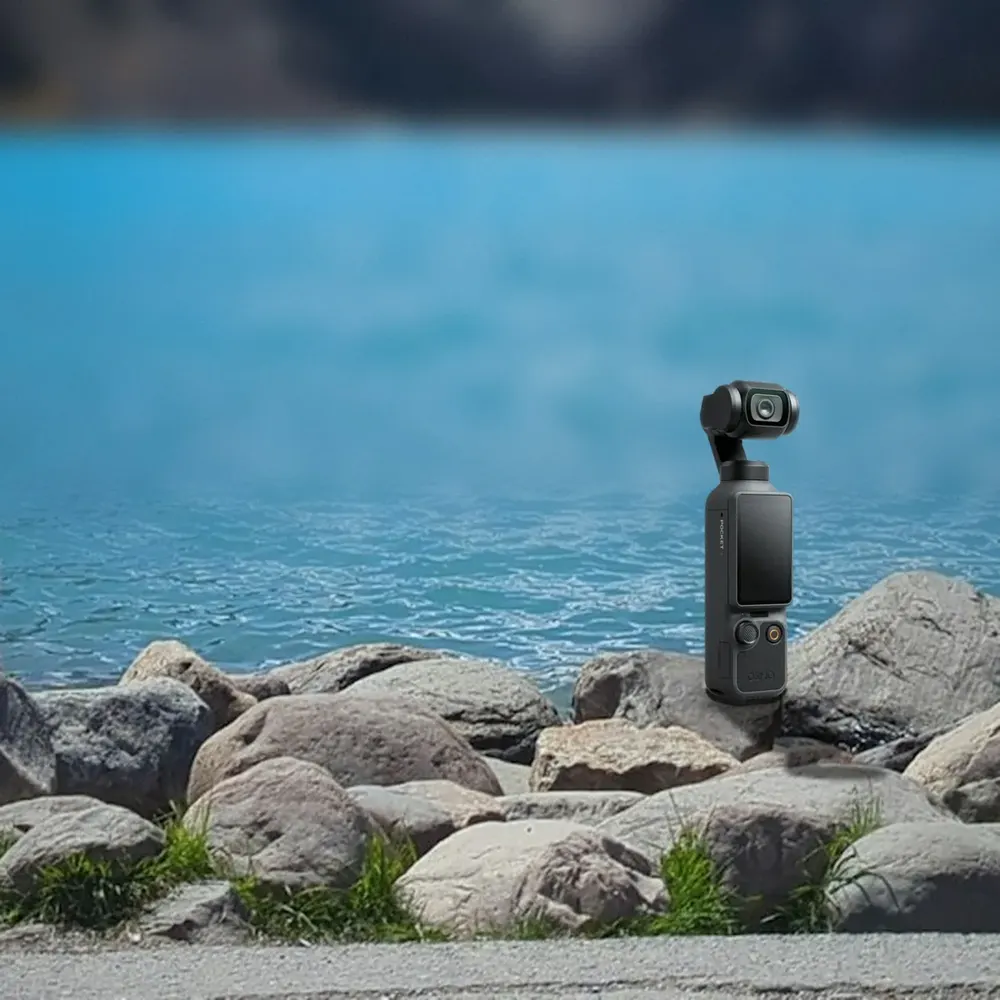 DJI Osmo Pocket 4 on a rock by a lake