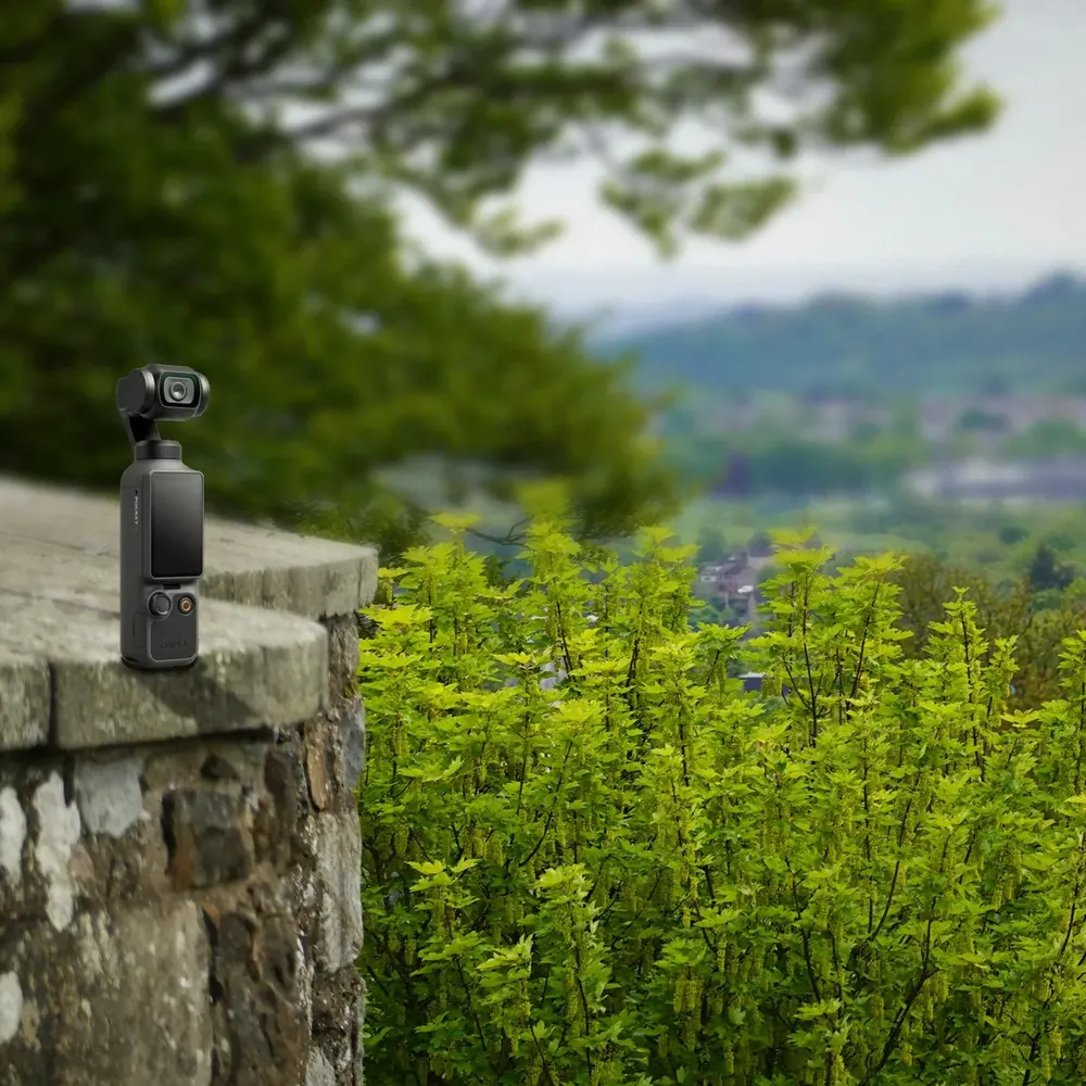DJI Osmo Pocket 4 on a stone wall