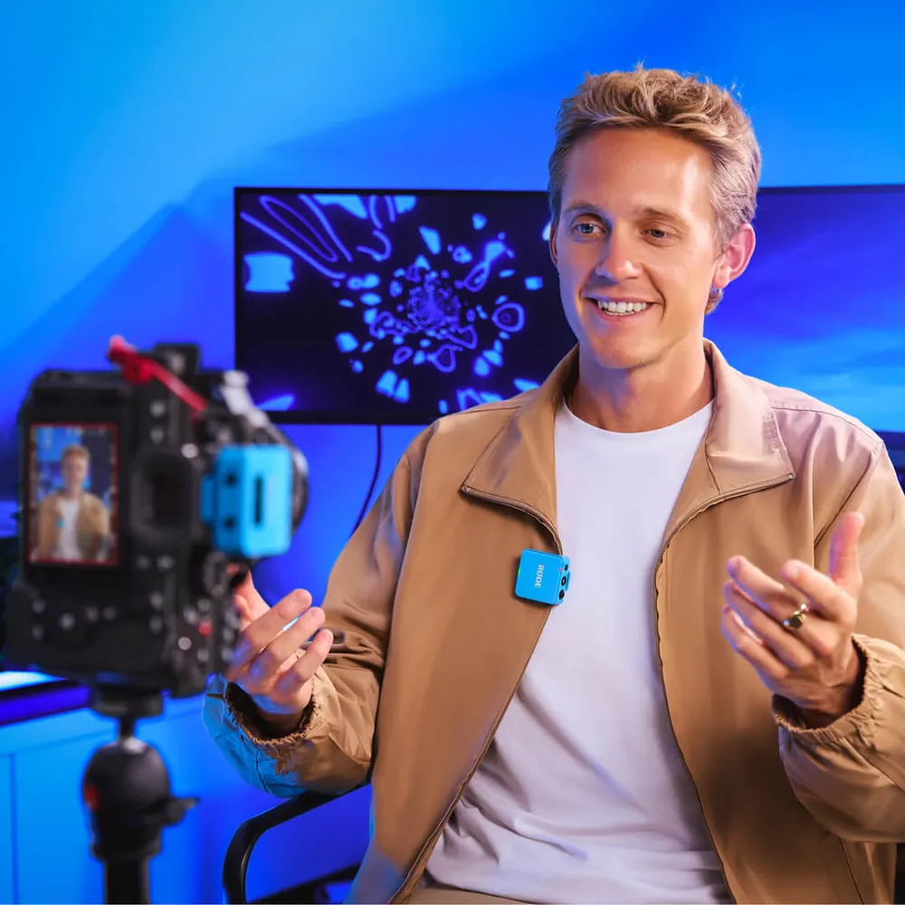 RODE Wireless GO (Gen 3), used by a streamer at a desk, official RODE image